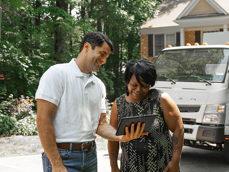 Junk Removal Expert with Client